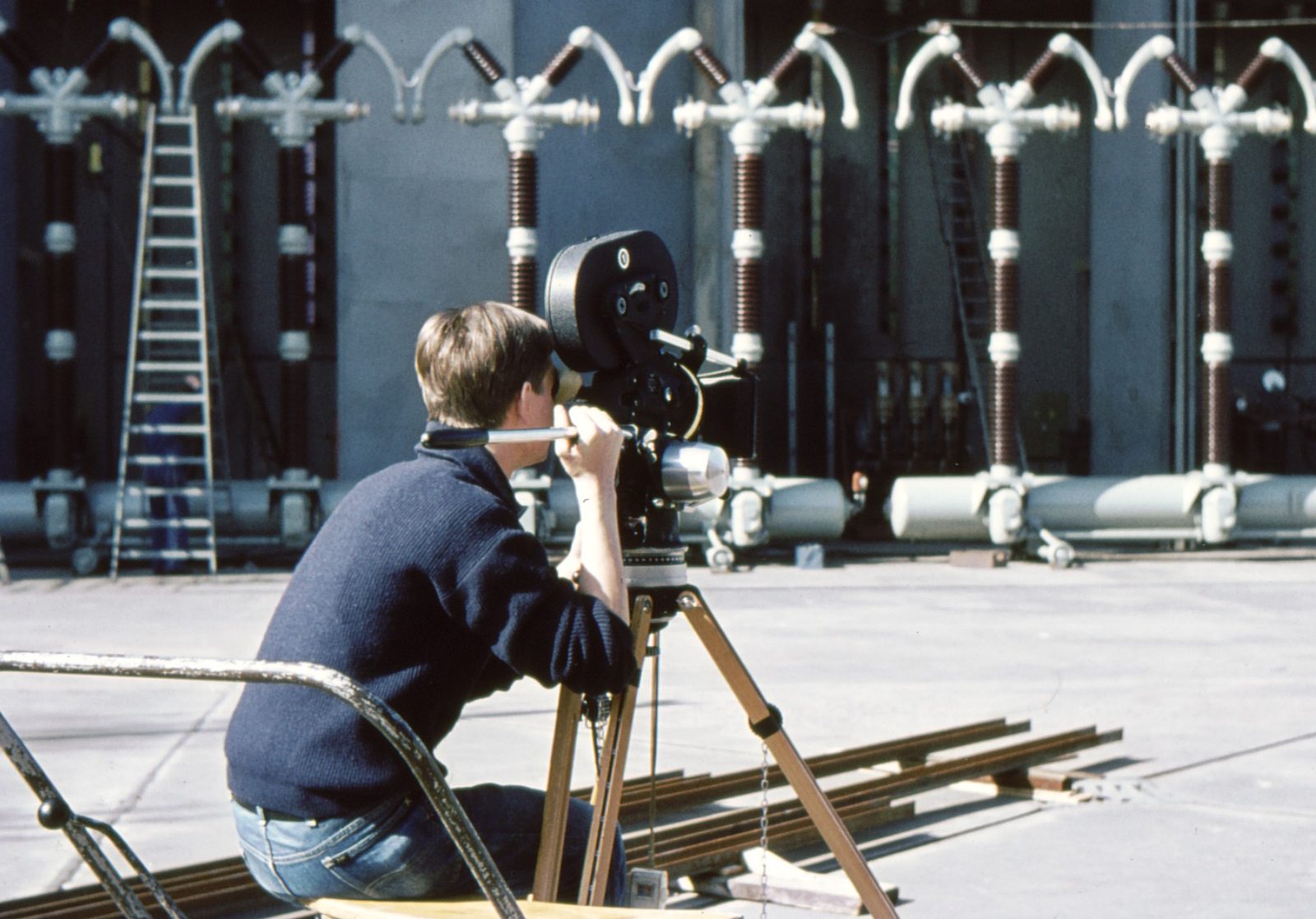 A camera operator shooting with an Arriflex 35 on a rooftop, 1964