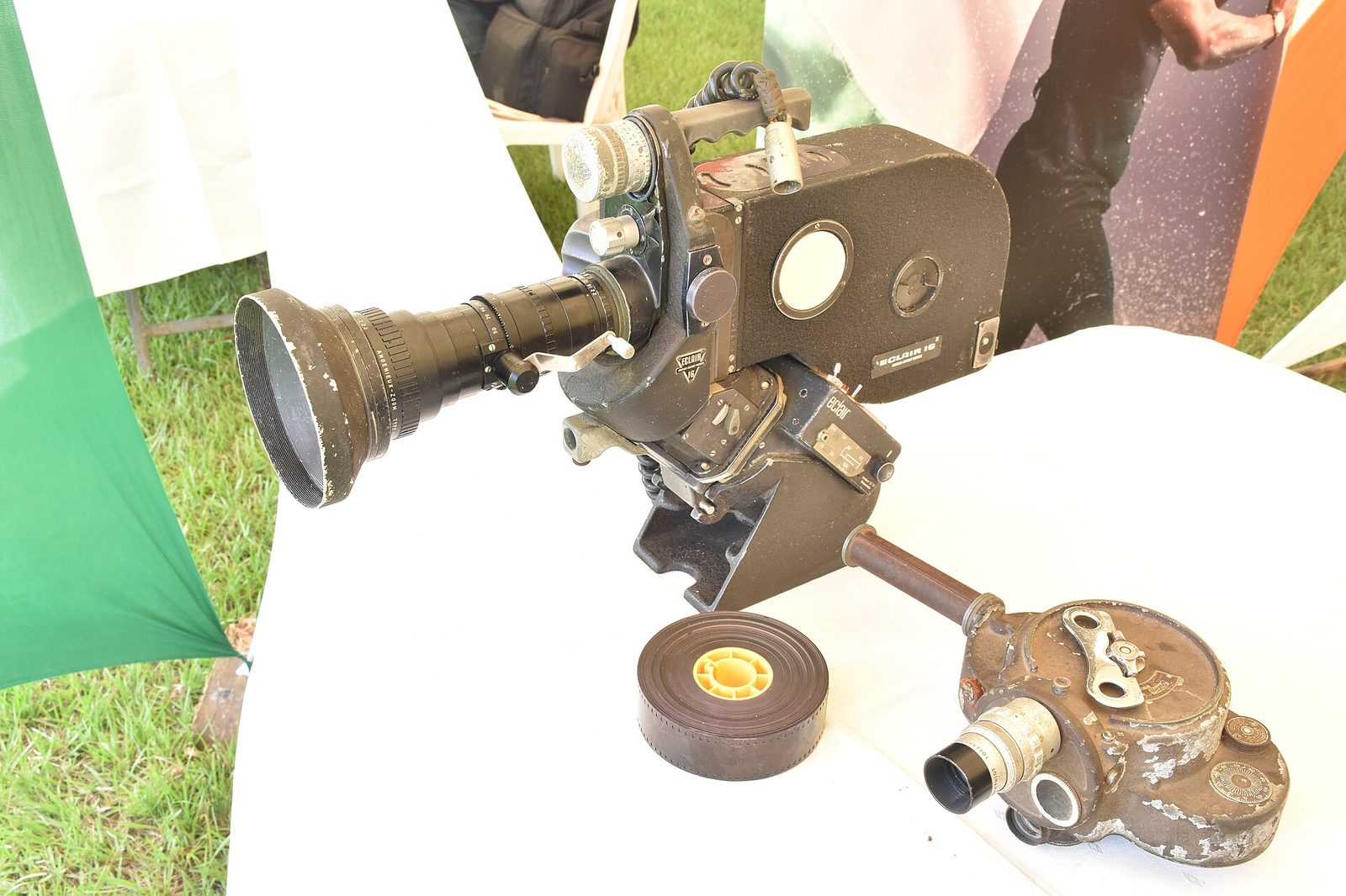 An Éclair 16 NPR with zoom lens beside a smaller 16mm camera on a display table