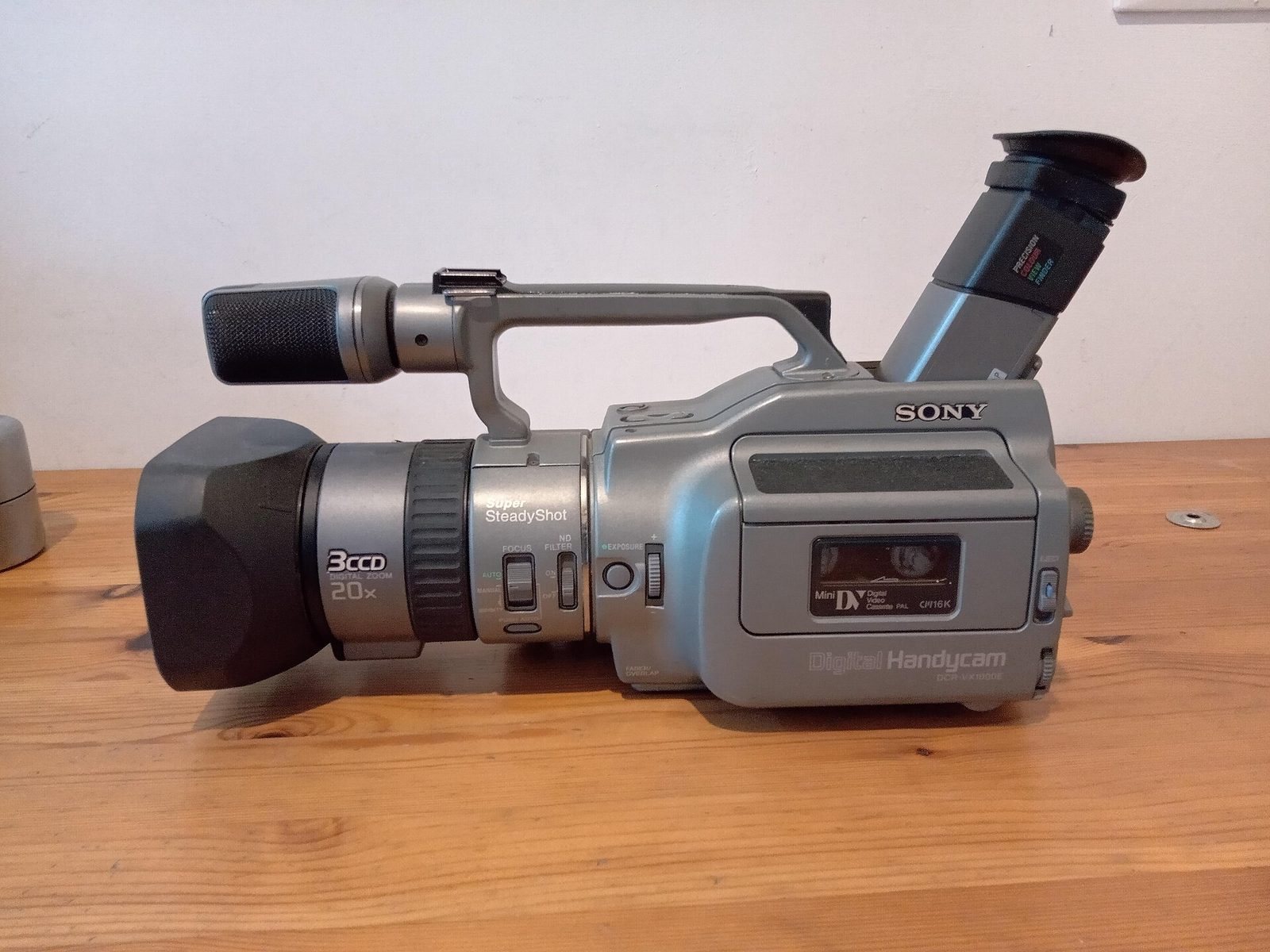 Sony DCR-VX1000 camcorder on a wooden table