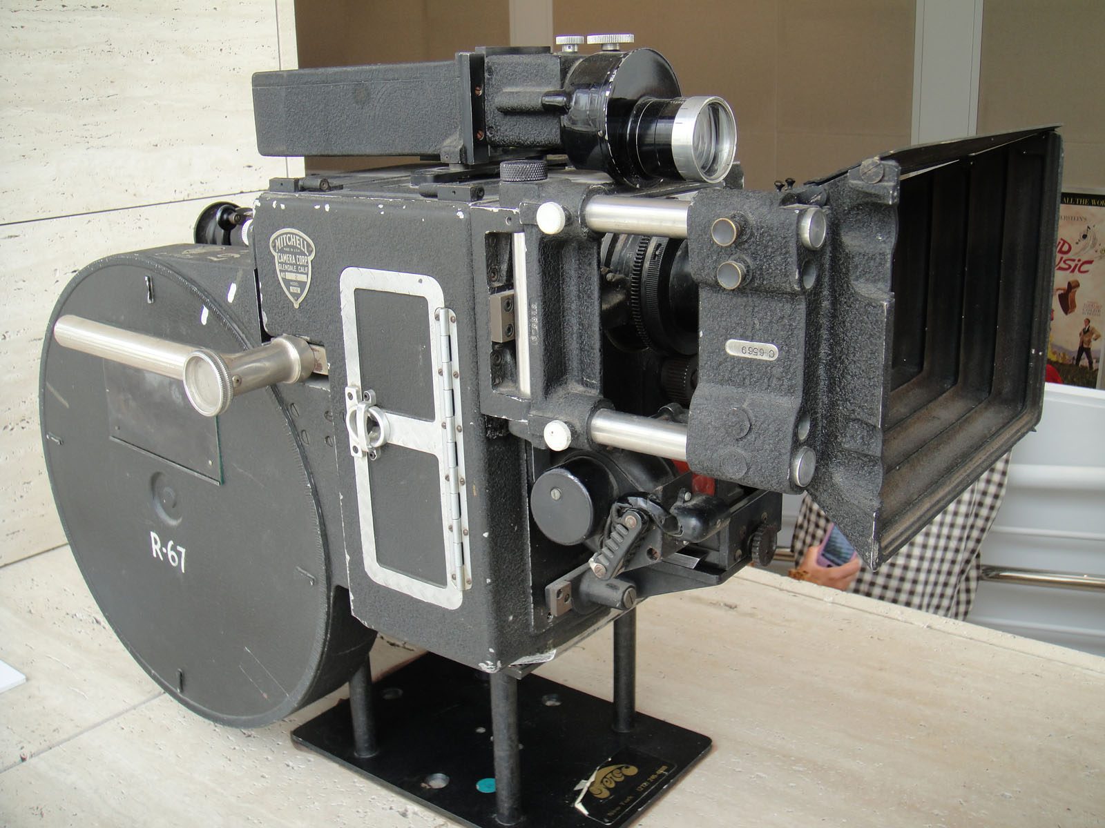 Three-quarter view of a Mitchell Model V-V VistaVision camera showing its lens, matte box and large horizontal film magazine.